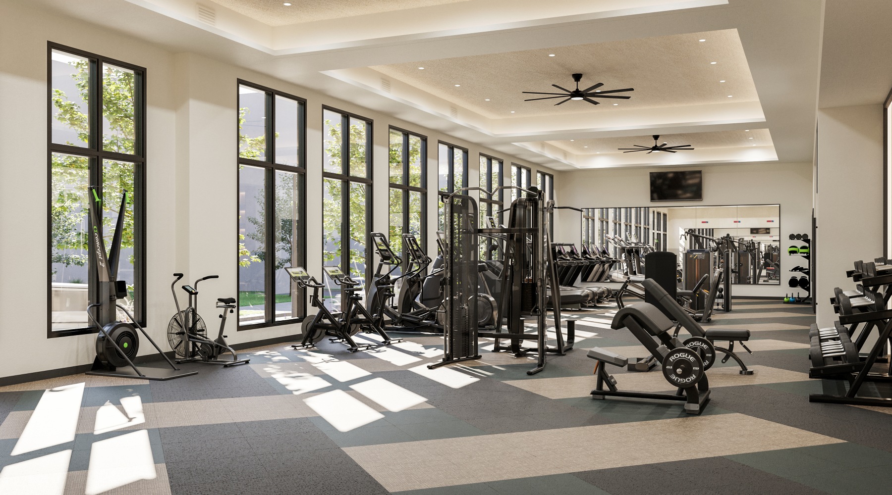 fitness area with treadmills and ceiling lighting