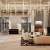 a spacious room with a fireplace and tall windows