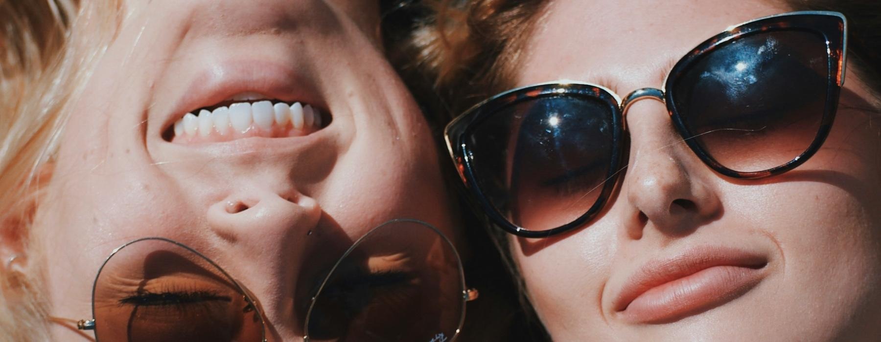 a couple of women wearing sunglasses