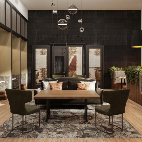 a room with a couch and chairs